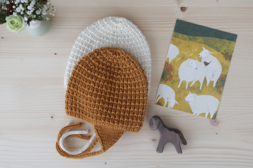 White and Caramel Baby Bonnet with Congratulations Card and Flowers