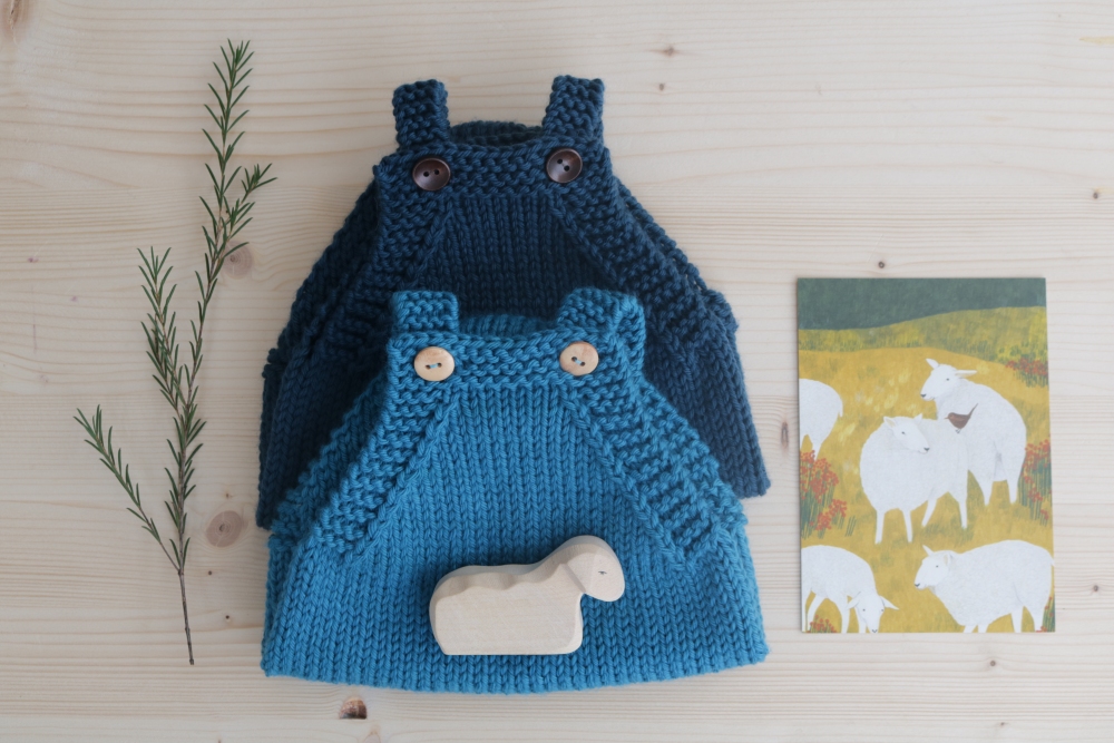 Dark blue and light blue romper suit with greeting card